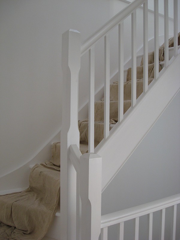 A painted softwood single turn three winder staircase for a loft conversion.