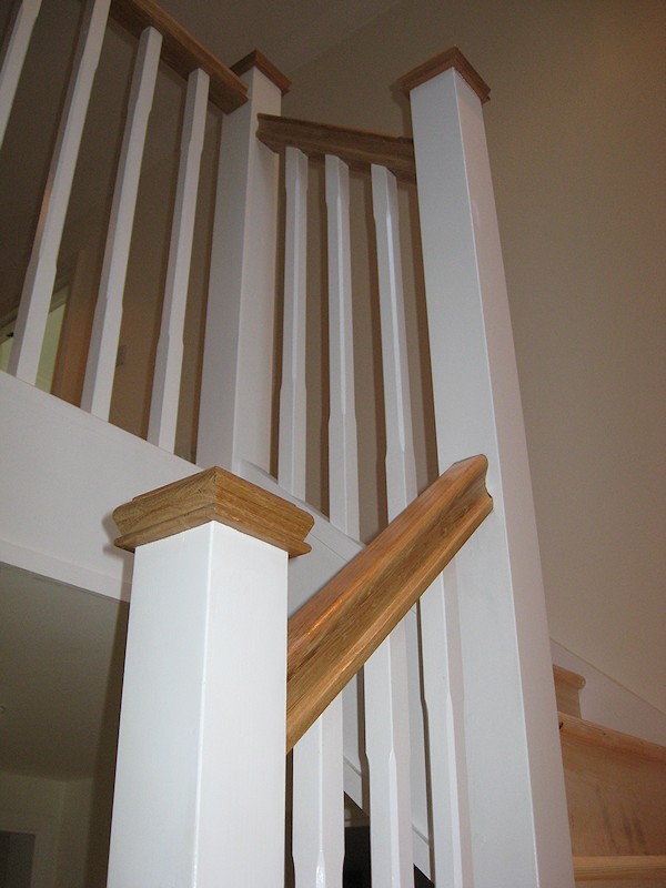 A double turn six winder staircase leading down into a basement.