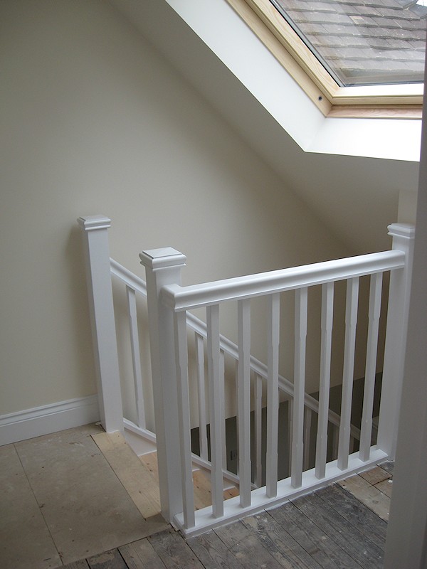 A single turn softwood three winder staircase with a bullnose bottom tread.