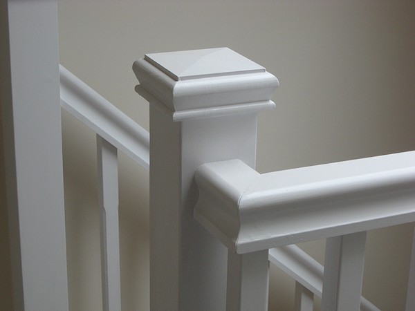 A single turn softwood three winder staircase with a bullnose bottom tread.