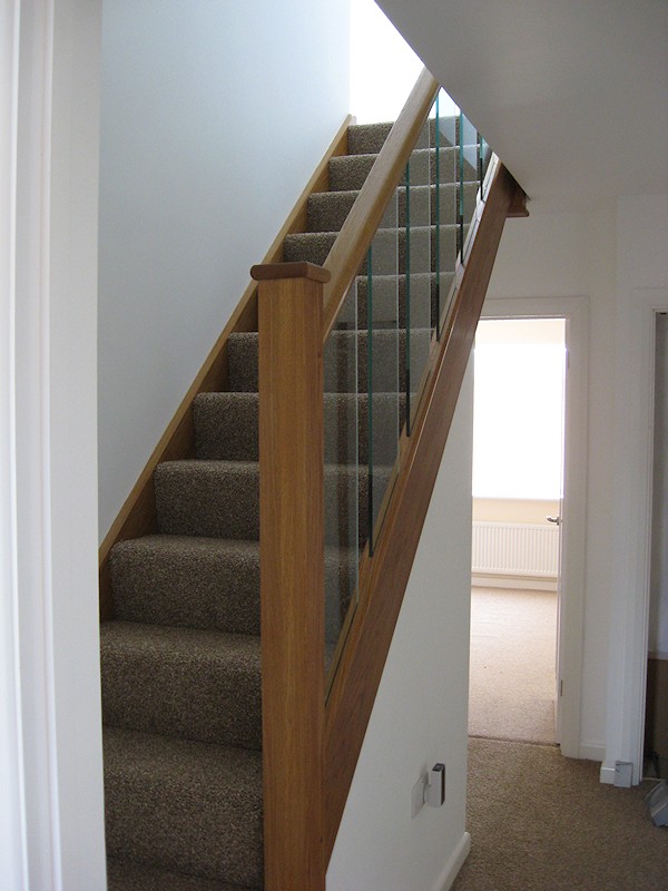 A clockwise single turn, three winder staircase in oak construction.