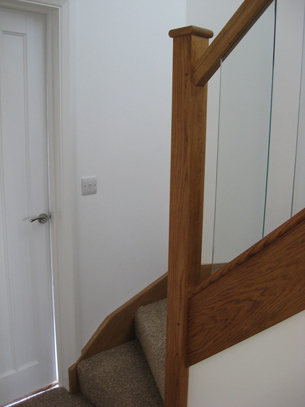 A clockwise single turn, three winder staircase in oak construction.