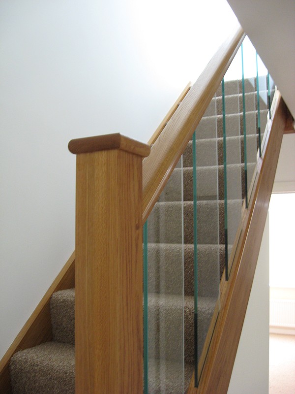 A clockwise single turn, three winder staircase in oak construction.