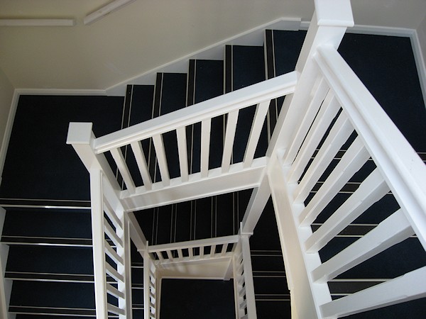 Two softwood painted stairs designed for high traffic usage.