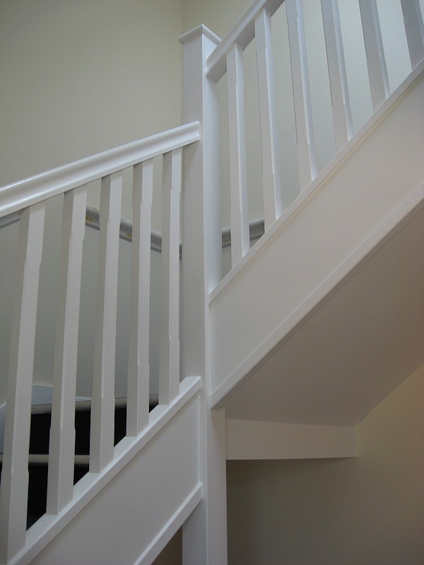 Two softwood painted stairs designed for high traffic usage.