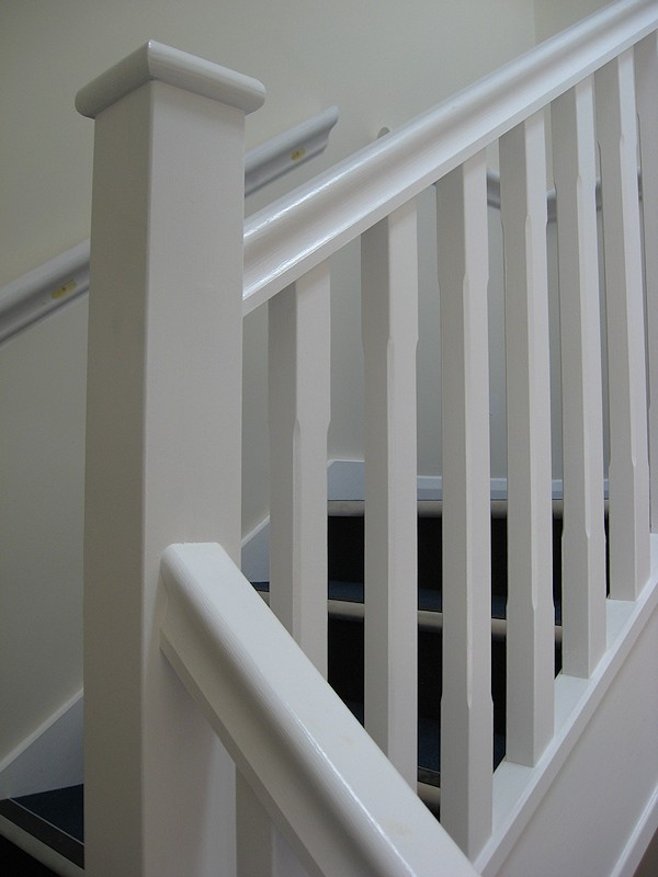 Two softwood painted stairs designed for high traffic usage.