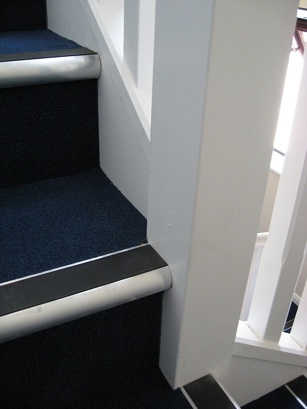 Two softwood painted stairs designed for high traffic usage.