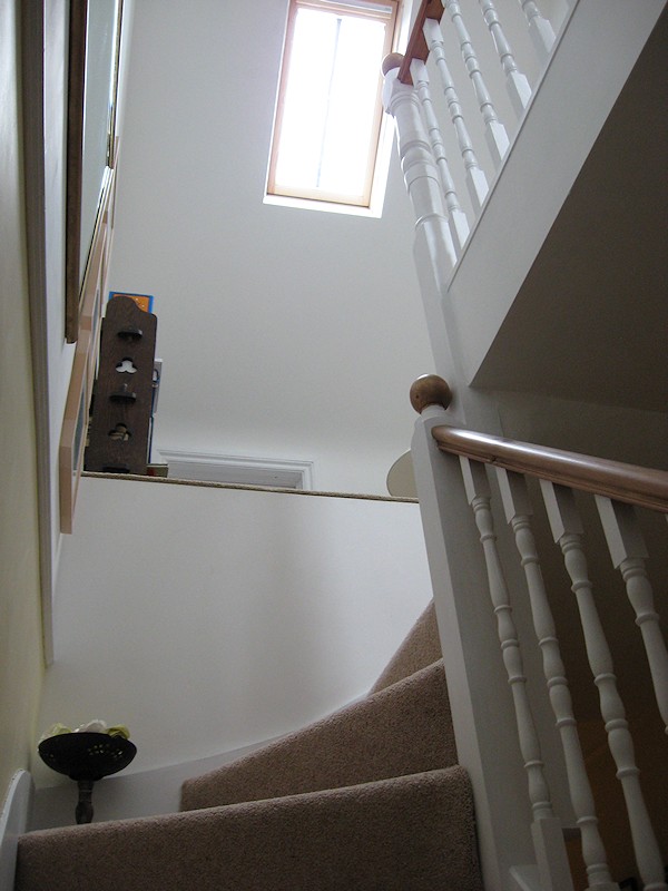 This softwood staircase for a loft conversion has a total of nine winders turning three times over 270 degrees.