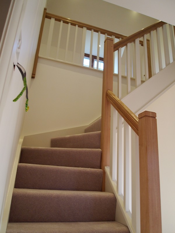 A softwood single turn winder staircase for a loft conversion.