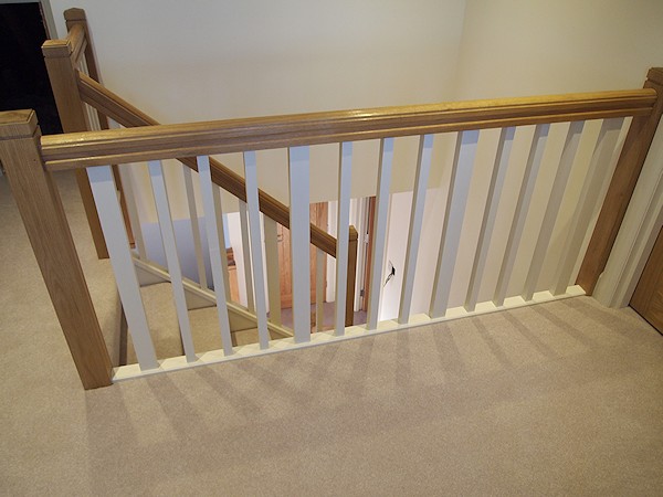 A softwood single turn winder staircase for a loft conversion.