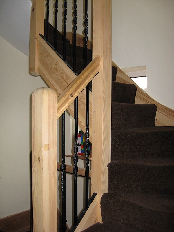 A softwood double turn winder staircase for a loft conversion