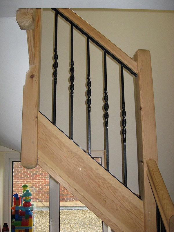 A softwood double turn winder staircase for a loft conversion