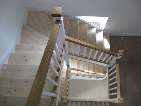 Two winder flights positioned above one another, accessing three floors to this new build large detached family home.