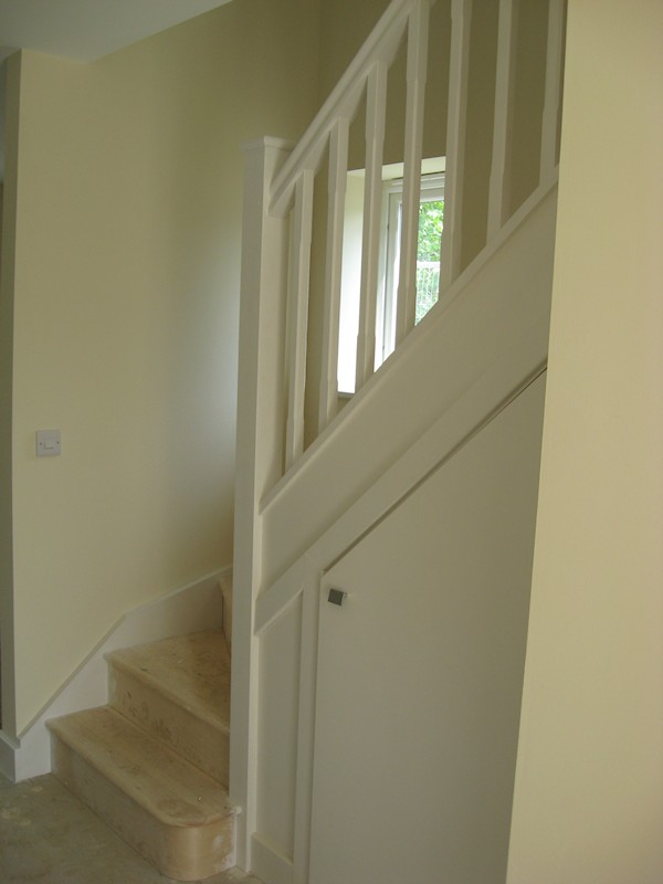 The balustrade comprises of our std handrail, stop chamfer 32mm spindles and flat with rounded edge newel caps.