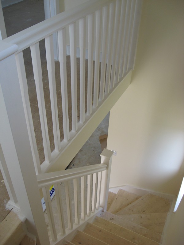 The balustrade comprises of our std handrail, stop chamfer 32mm spindles and flat with rounded edge newel caps.