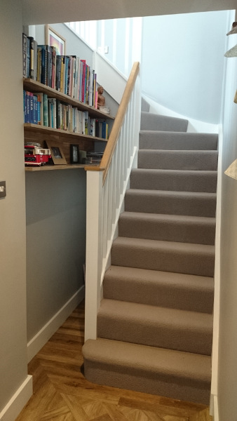 Staircase painted white with our std profile handrail and flat newel caps in oak giving a great contrasting feature.