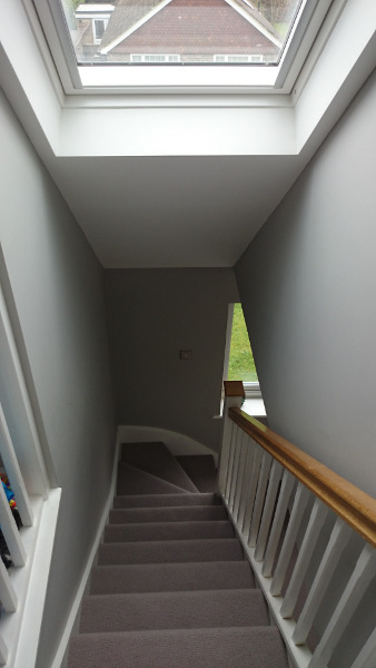 Staircase painted white with our std profile handrail and flat newel caps in oak giving a great contrasting feature.