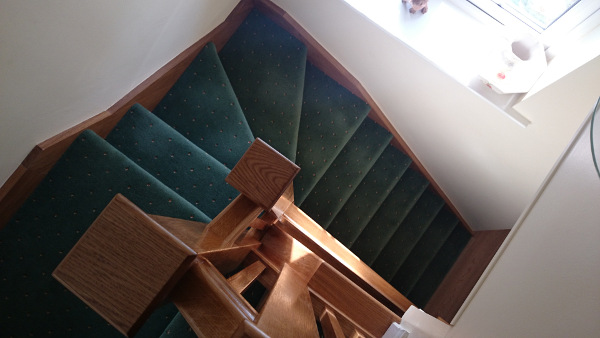 Oak construction staircase including our std handrail, square spindles and flat newel caps.