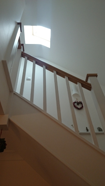Staircase for loft onversion in bungalow incorporating six winders, along with oak ornate handrail and pyramid caps.