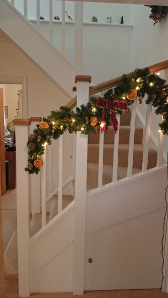 Staircase for loft onversion in bungalow incorporating six winders, along with oak ornate handrail and pyramid caps.