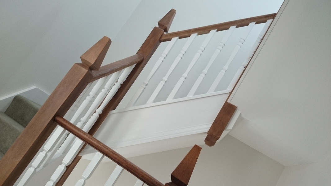 A very unique staircase, just look at those newel tops!