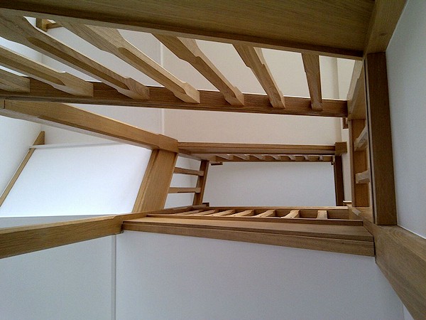 All european oak construction staircase comprising of stop chamfer newels/spindles and ornate handrail