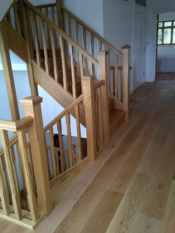 All european oak construction staircase comprising of stop chamfer newels/spindles and ornate handrail