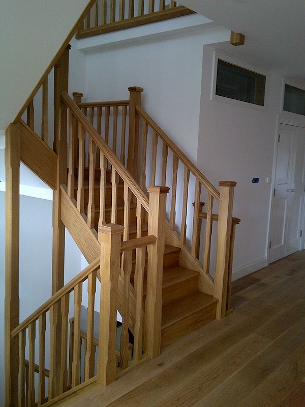 All european oak construction staircase comprising of stop chamfer newels/spindles and ornate handrail