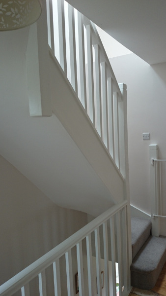 Room in the roof double winder staircase, all redwood painted.