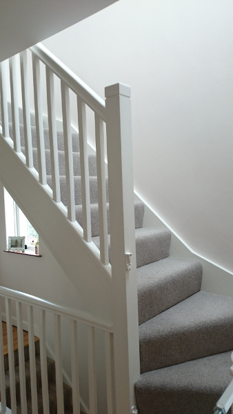 Room in the roof double winder staircase, all redwood painted.