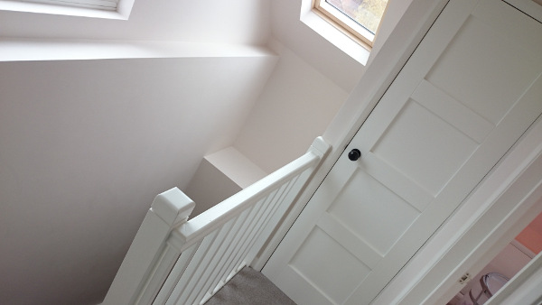 Room in the roof double winder staircase, all redwood painted.