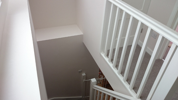 Room in the roof double winder staircase, all redwood painted.