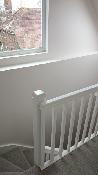 Room in the roof double winder staircase, all redwood painted.