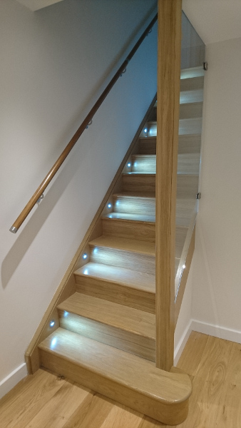 A straight flight staircase in oak.