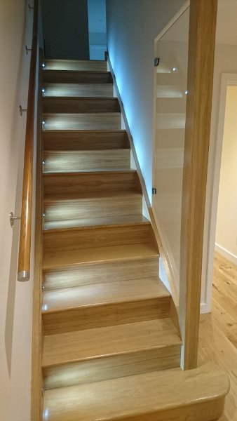 A straight flight staircase in oak.