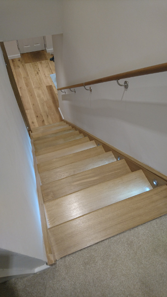 A straight flight staircase in oak.