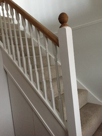 Loft conversion winder staircase using Georgian turned spindles.