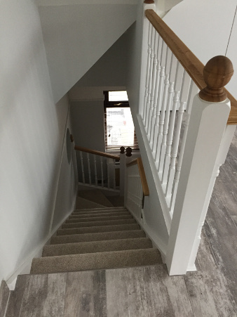 Loft conversion winder staircase using Georgian turned spindles.