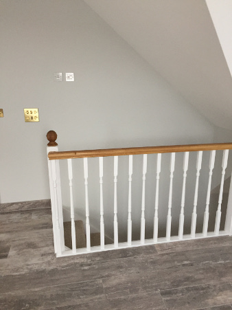 Loft conversion winder staircase using Georgian turned spindles.