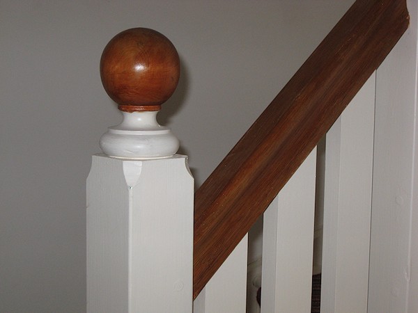 This softwood double winder staircase was for a loft conversion, painted white with a carpet runner.