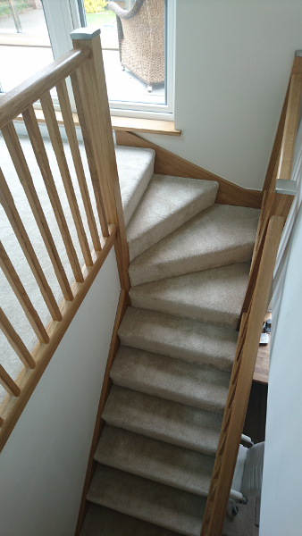 Oak winder staircase using our crown profile handrail.