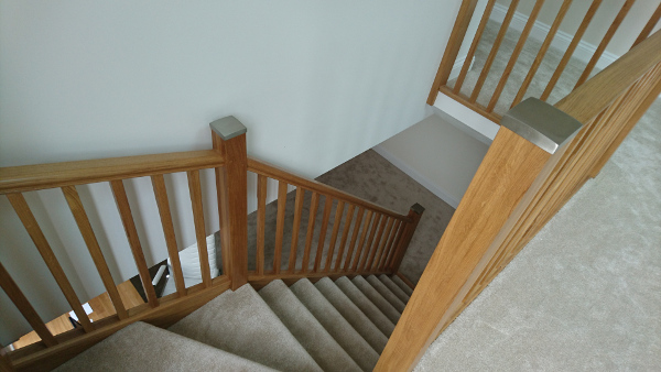 Oak winder staircase using our crown profile handrail.