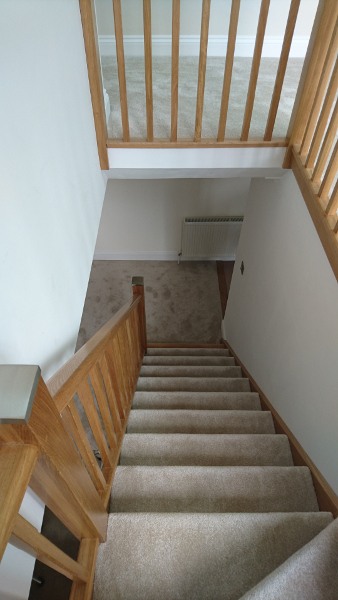 Oak winder staircase using our crown profile handrail.