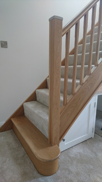 Oak winder staircase using our crown profile handrail.